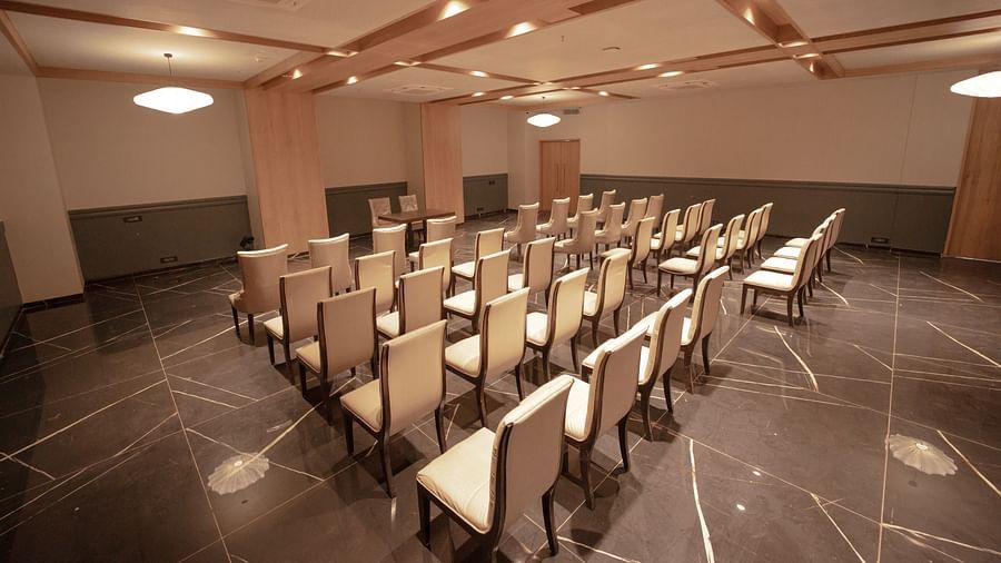 An image of a banquet hall featuring several chairs at Pride Resort Ambaji